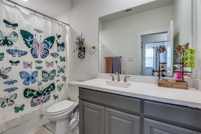 full bath featuring vanity, shower / bath combination with curtain, toilet, and visible vents