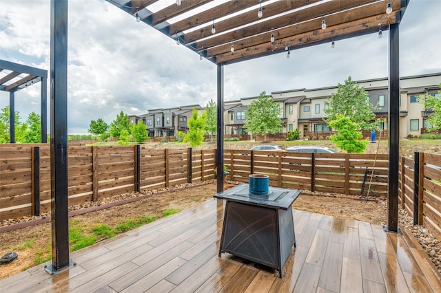 deck featuring fence and a residential view