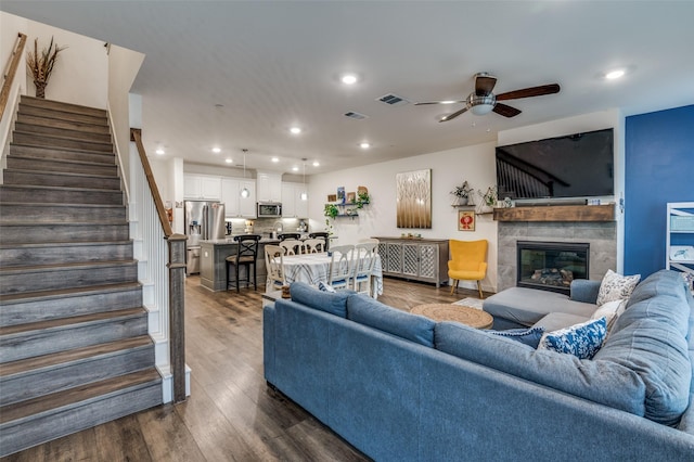 living room featuring stairway, a ceiling fan, recessed lighting, and visible vents
