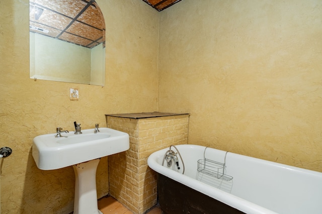 bathroom with a soaking tub