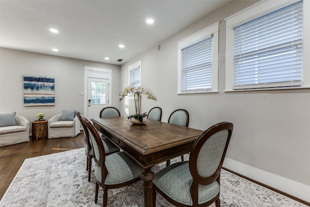 dining room featuring recessed lighting, baseboards, and wood finished floors
