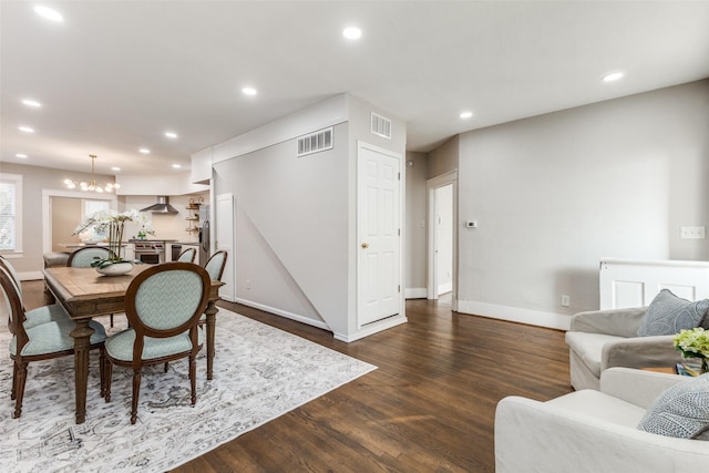 dining area with visible vents, dark wood-style flooring, baseboards, recessed lighting, and a notable chandelier