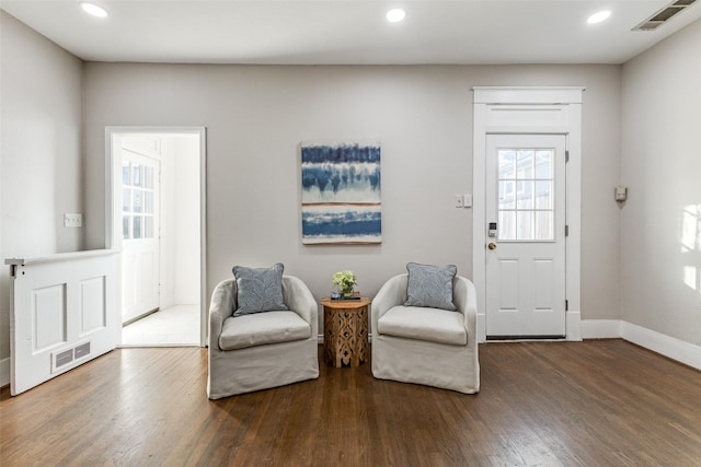 sitting room with visible vents, recessed lighting, baseboards, and wood finished floors