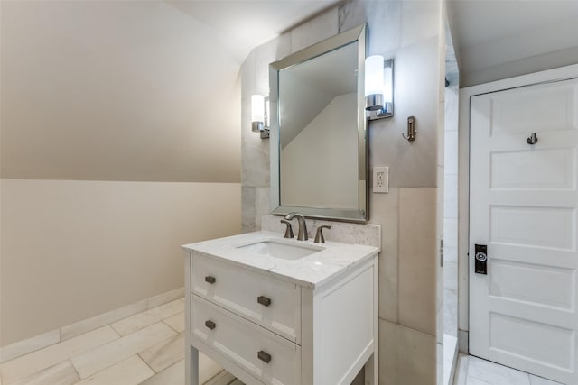 bathroom featuring baseboards and vanity