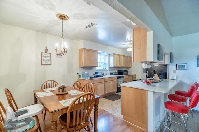 5631 Southmoor Dr, Abilene, TX 79606 - kitchen featuring black microwave, light brown cabinets, decorative backsplash, and visible vents