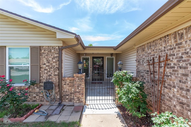5631 Southmoor Dr, Abilene, TX 79606 - property entrance featuring brick siding and a gate