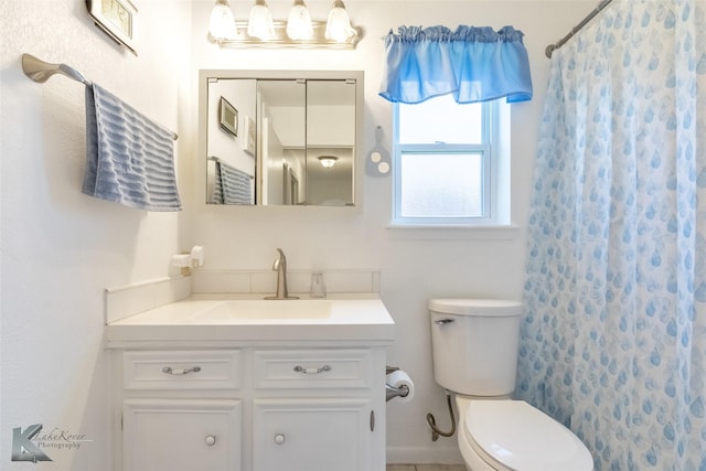 5631 Southmoor Dr, Abilene, TX 79606 - full bathroom with toilet, a shower with shower curtain, and vanity