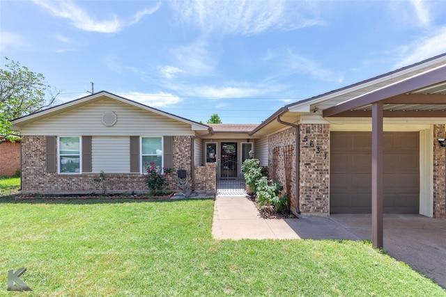 5631 Southmoor Dr, Abilene, TX 79606 - single story home featuring an attached garage, driveway, a front lawn, and brick siding