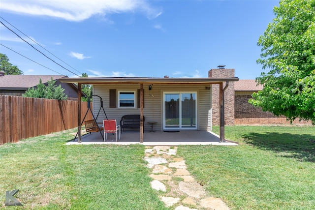 5631 Southmoor Dr, Abilene, TX 79606 - rear view of house with a yard, a patio, fence, and a chimney
