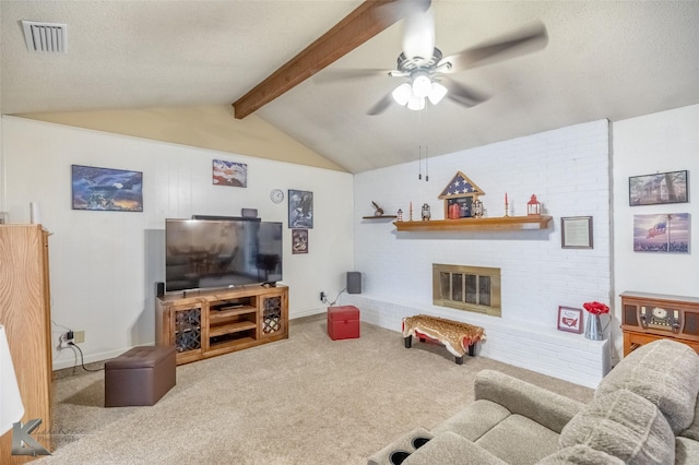 5631 Southmoor Dr, Abilene, TX 79606 - carpeted living room featuring visible vents, a brick fireplace, ceiling fan, vaulted ceiling with beams, and a textured ceiling