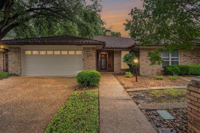 832 Havenwood Ln S, Fort Worth, TX 76112 - ranch-style house with an attached garage, a chimney, driveway, and brick siding