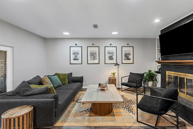 832 Havenwood Ln S, Fort Worth, TX 76112 - living area featuring a brick fireplace, recessed lighting, visible vents, and light wood-style flooring
