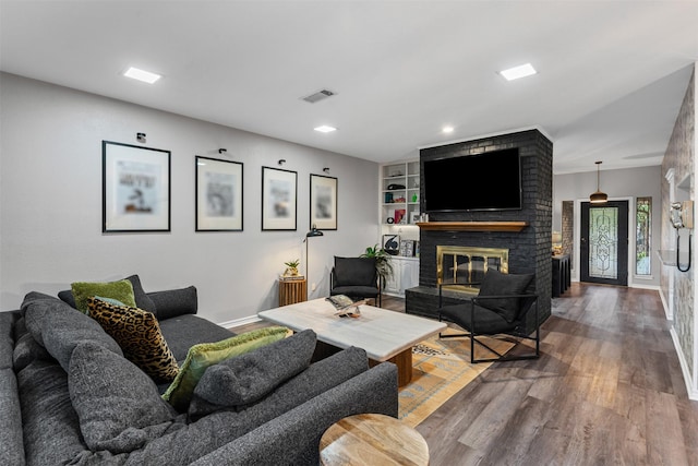 832 Havenwood Ln S, Fort Worth, TX 76112 - living room featuring visible vents, a brick fireplace, wood finished floors, baseboards, and recessed lighting