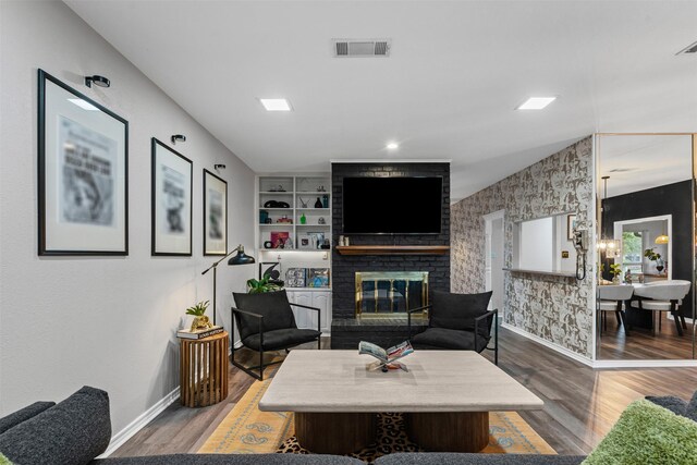 832 Havenwood Ln S, Fort Worth, TX 76112 - living room with baseboards, a brick fireplace, wood finished floors, and visible vents