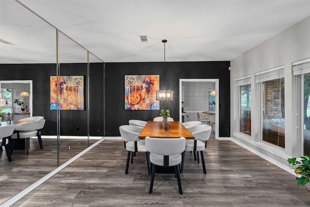 832 Havenwood Ln S, Fort Worth, TX 76112 - dining room featuring a notable chandelier, visible vents, and wood finished floors