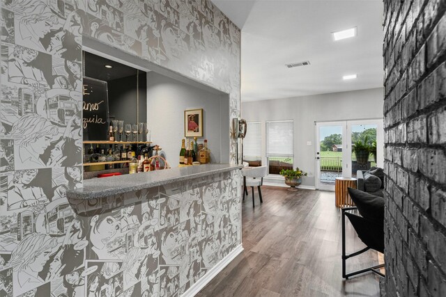 832 Havenwood Ln S, Fort Worth, TX 76112 - bar with a dry bar, french doors, wood finished floors, and visible vents