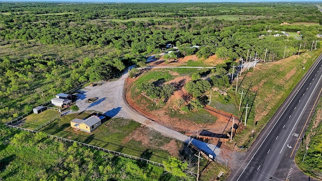 drone / aerial view featuring a forest view
