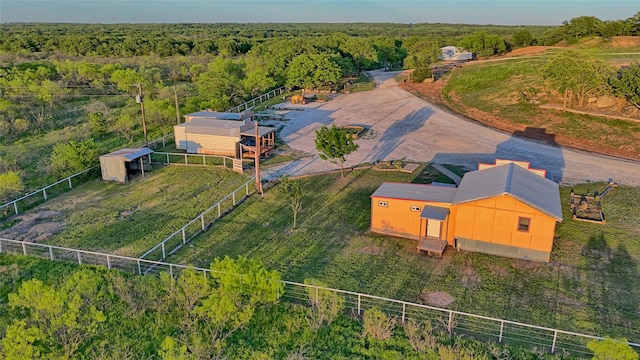 birds eye view of property with a wooded view