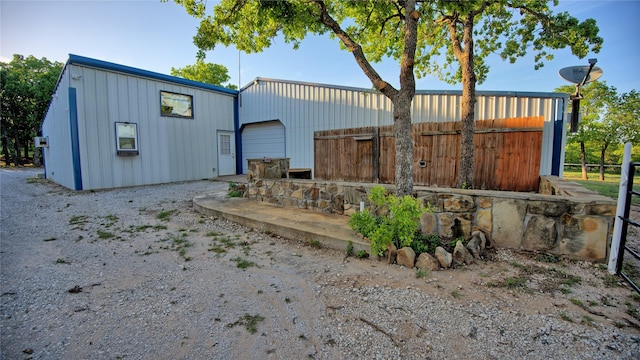 view of outbuilding with fence