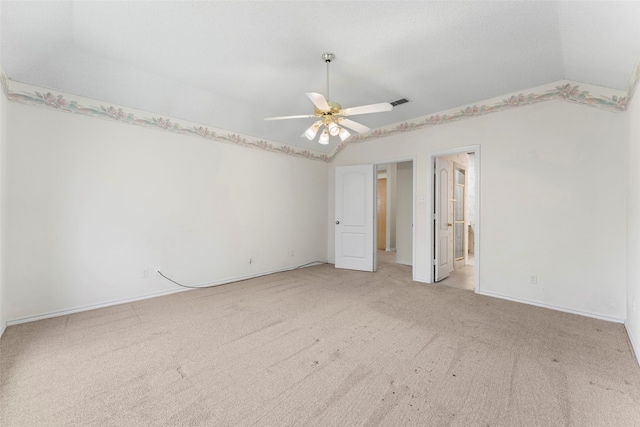 7632 Arbor Ridge Ct, Fort Worth, TX 76112 - unfurnished bedroom with vaulted ceiling, light carpet, baseboards, a ceiling fan, and connected bathroom