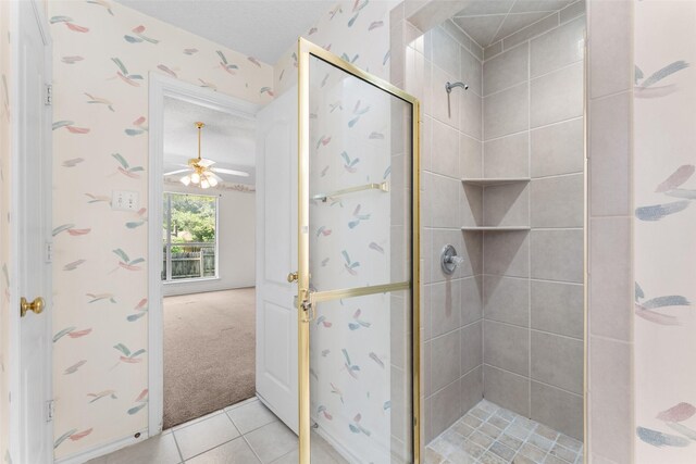 7632 Arbor Ridge Ct, Fort Worth, TX 76112 - bathroom featuring a stall shower, ceiling fan, tile patterned flooring, and wallpapered walls