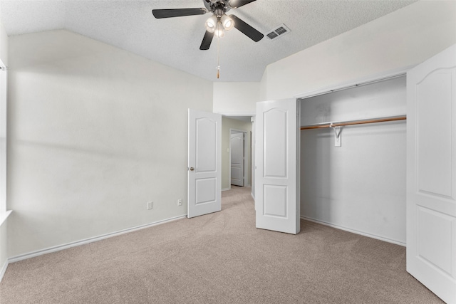 7632 Arbor Ridge Ct, Fort Worth, TX 76112 - unfurnished bedroom with light colored carpet, a textured ceiling, lofted ceiling, a closet, and ceiling fan