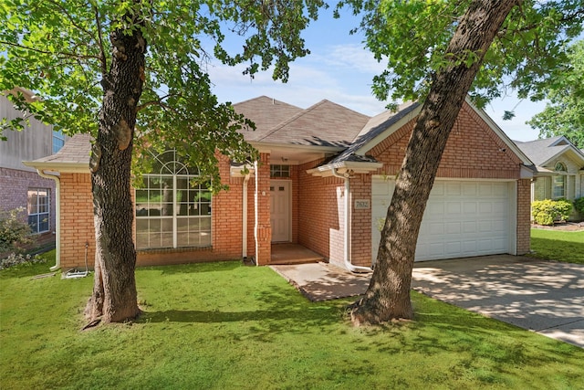 7632 Arbor Ridge Ct, Fort Worth, TX 76112 - view of front facade with concrete driveway, a garage, a front yard, and brick siding
