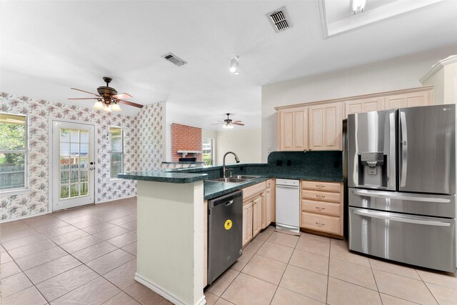 7632 Arbor Ridge Ct, Fort Worth, TX 76112 - kitchen featuring appliances with stainless steel finishes, a sink, wallpapered walls, a ceiling fan, and dark countertops