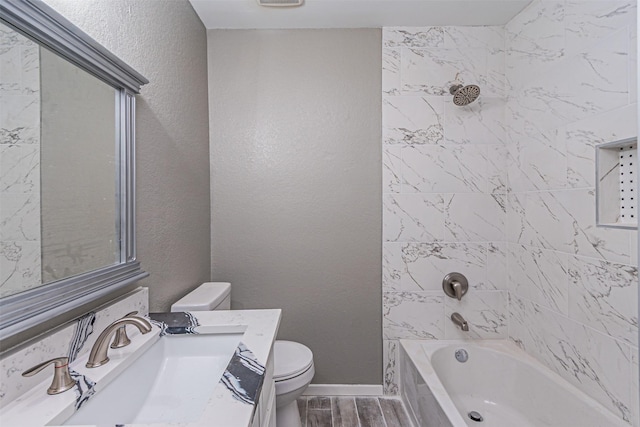 full bathroom with vanity, shower / bathtub combination, toilet, baseboards, and wood finished floors
