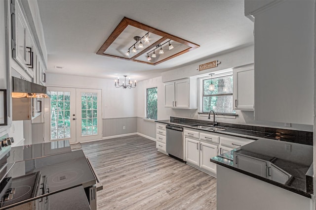 kitchen featuring range with electric stovetop, dark countertops, a sink, and dishwasher