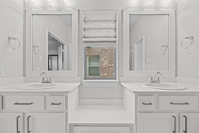 bathroom with two vanities and a sink