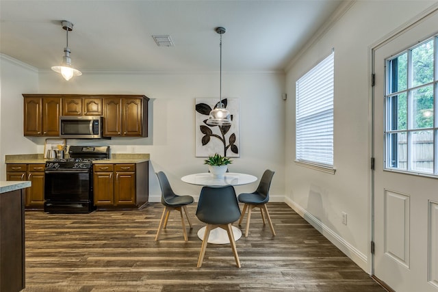 2416 Dogwood Dr, Little Elm, TX 75068 - dining space featuring crown molding, dark wood-style floors, and baseboards