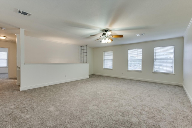 2416 Dogwood Dr, Little Elm, TX 75068 - empty room featuring a ceiling fan, carpet, and healthy amount of natural light