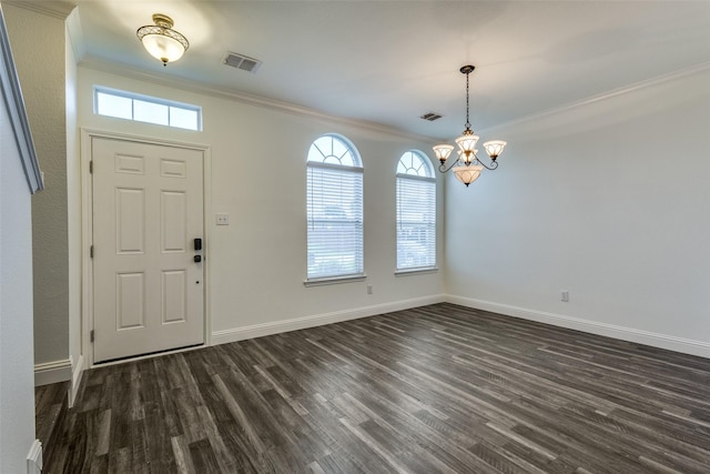 2416 Dogwood Dr, Little Elm, TX 75068 - entryway with crown molding, dark wood finished floors, a chandelier, and baseboards