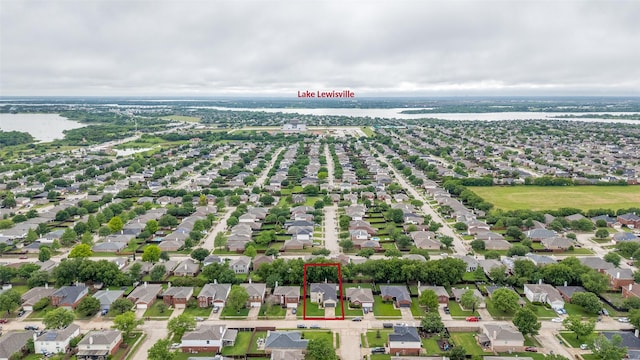 2416 Dogwood Dr, Little Elm, TX 75068 - aerial view of residential area with property parcel outlined and a nearby body of water