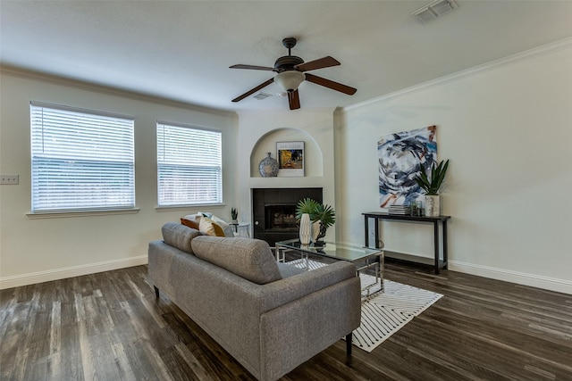 2416 Dogwood Dr, Little Elm, TX 75068 - living area featuring baseboards, wood finished floors, a ceiling fan, crown molding, and a tile fireplace