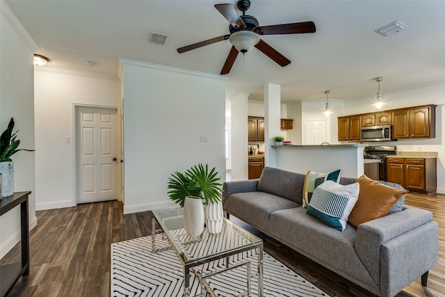2416 Dogwood Dr, Little Elm, TX 75068 - living area featuring ornamental molding, ceiling fan, dark wood-style floors, and baseboards