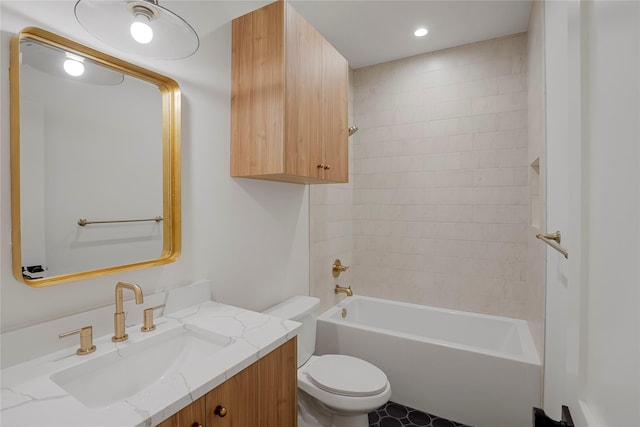 bathroom featuring toilet, washtub / shower combination, vanity, and recessed lighting