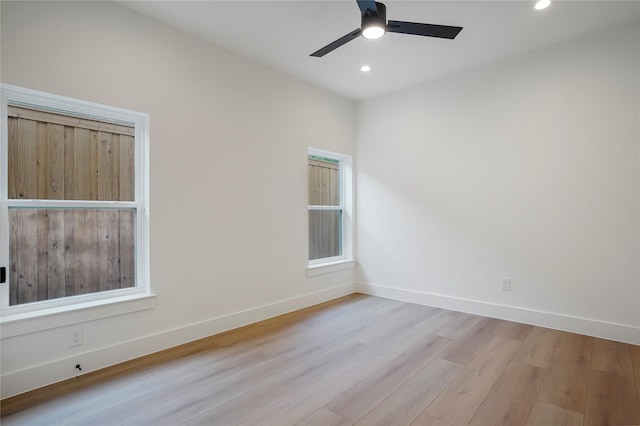 empty room featuring baseboards, ceiling fan, recessed lighting, and wood finished floors
