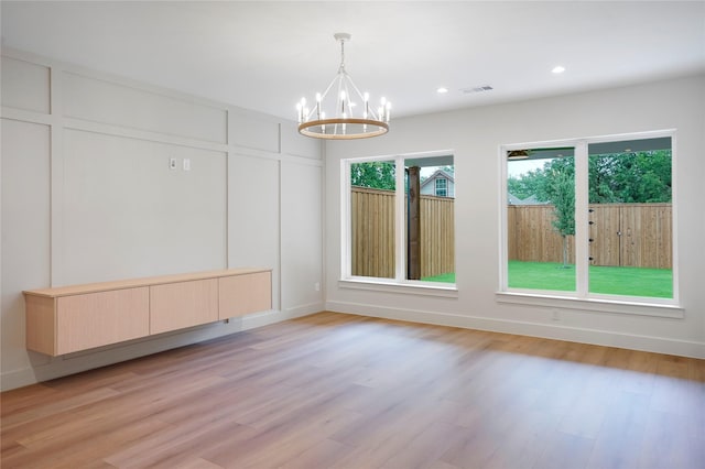 interior space with recessed lighting, light wood-style floors, visible vents, and a notable chandelier