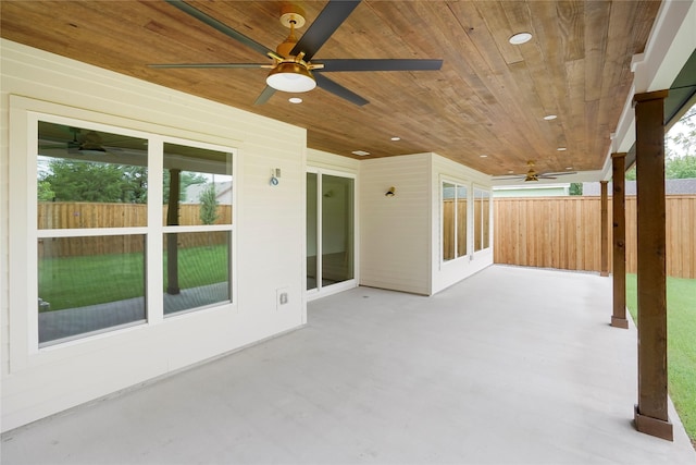 view of patio / terrace featuring ceiling fan and fence