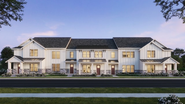 view of front of property featuring a standing seam roof, board and batten siding, and metal roof