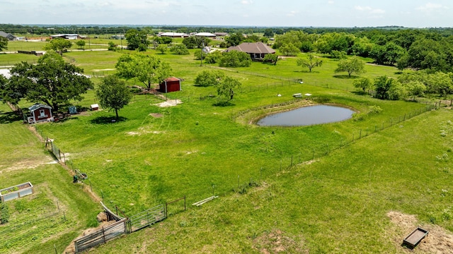 birds eye view of property with a rural view