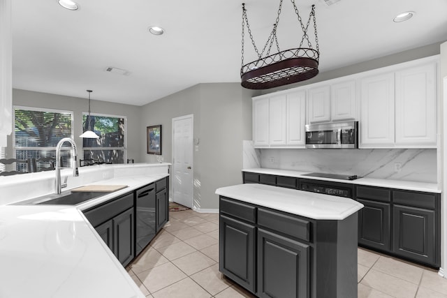 907 Ozark Dr, Allen, TX 75002 - kitchen with recessed lighting, white cabinets, a sink, backsplash, and black appliances