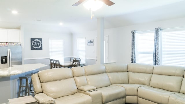 living area featuring ceiling fan