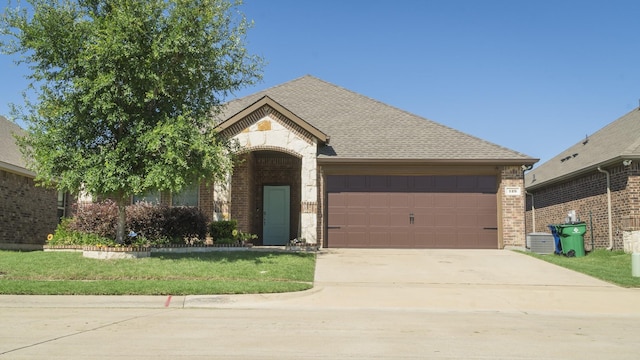 view of front of property with a garage, concrete driveway, roof with shingles, and brick siding