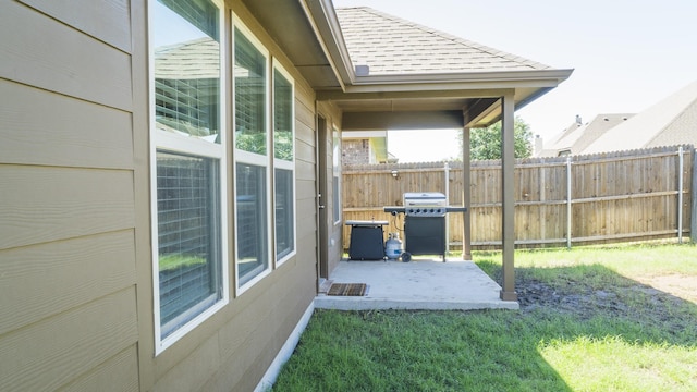 view of yard with a patio and fence