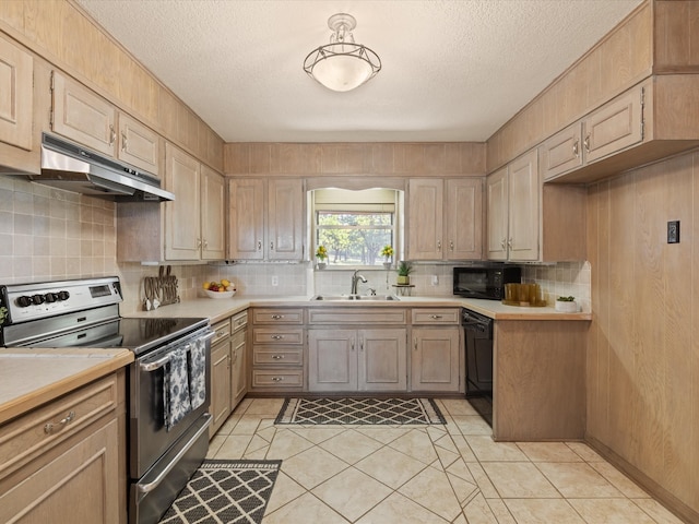 12580 Briar Rd, Azle, TX 76020 - kitchen featuring black appliances, a sink, under cabinet range hood, light countertops, and decorative backsplash