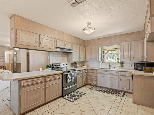 12580 Briar Rd, Azle, TX 76020 - kitchen with stainless steel electric range, under cabinet range hood, a sink, a peninsula, and light countertops