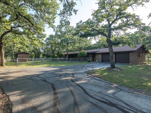12580 Briar Rd, Azle, TX 76020 - view of front facade with driveway, brick siding, and an attached garage